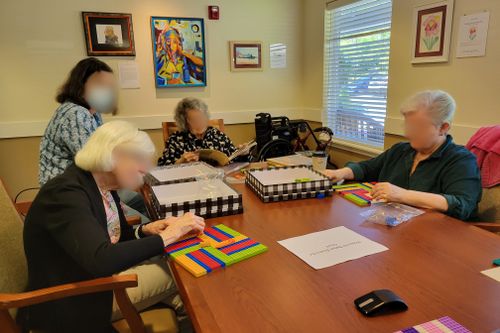 Blurred seniors engaging with one another and their brick work